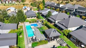 an aerial view of a home with a swimming pool at Alpine Cardrona by Aotearoa Escapes in Cardrona