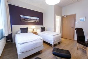 Postel nebo postele na pokoji v ubytování Centrum Hotel