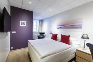 Postel nebo postele na pokoji v ubytování Centrum Hotel