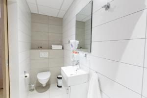 Koupelna v ubytování Centrum Hotel