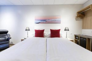 Postel nebo postele na pokoji v ubytování Centrum Hotel