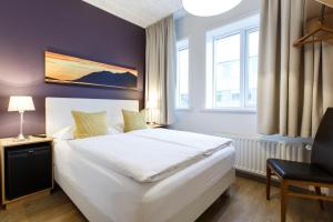 Postel nebo postele na pokoji v ubytování Centrum Hotel
