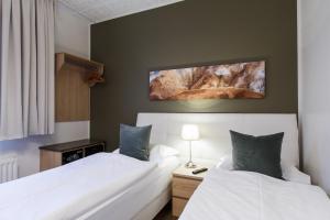 Postel nebo postele na pokoji v ubytování Centrum Hotel