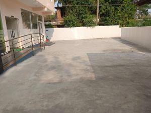 an empty parking lot in front of a building at Hotel Sindoor Inn in Parli
