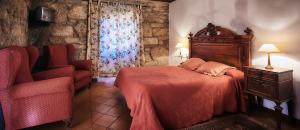 En eller flere senge i et værelse på Casa Cruceiro