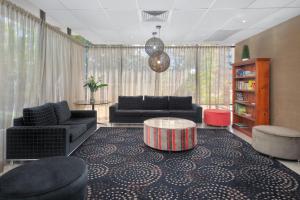 a living room with couches and a coffee table at Summit Apartments Brisbane City in Brisbane