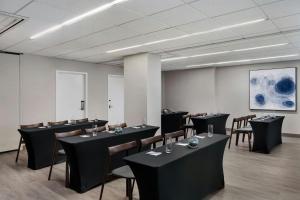 a dining room with black tables and chairs at Fairfield Inn and Suites Chicago Downtown/ Magnificent Mile in Chicago