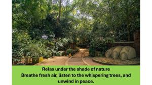 a book with a picture of a park with trees at Ceylon Kingsmen Garden - Katunayake Airport Transit Hotels in Negombo