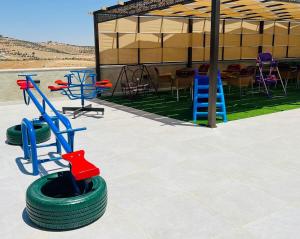 a group ofokedoked tires with chairs and a table at Al Maha Farm in Jerash