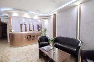 a lobby of a hotel with a couch and a table at Time Boutique Hotel in Yerevan
