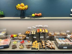 a display case with many different types of food at Hotel Aurora Duino in Duino