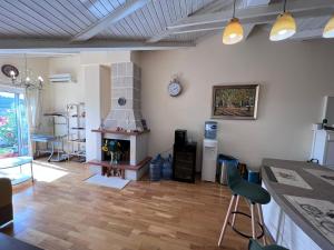 a living room with a fireplace and a stove at SUNTIME apartament 5 in Kotor +9 photos