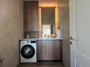 a washing machine in a bathroom with a sink at Villa MIO in Bar