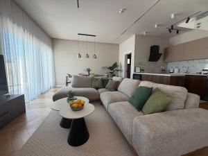 a living room with a couch and a table at Villa MIO in Bar