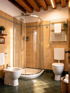a bathroom with a shower and a toilet and a sink at Boutique Rooms 3 0 in Ferrara