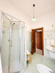 a bathroom with a shower and a sink at Il Canneto in Positano +51 photos