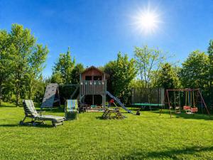 a park with a playground with a slide at Pension Höchemer in Bad Bocklet