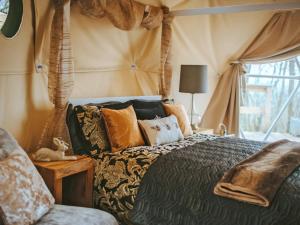 a bedroom with a bed in a tent at The Tree Dome - Ukc6979 in Ludlow