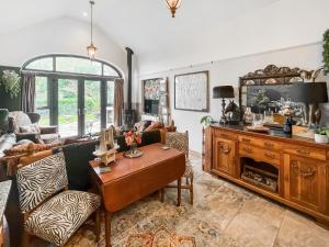 a living room with a couch and a table at Bert's Barn in Firsby