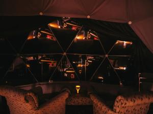 a room with two chairs and a ceiling with lights at The Star Dome - Ukc6978 in Ludlow