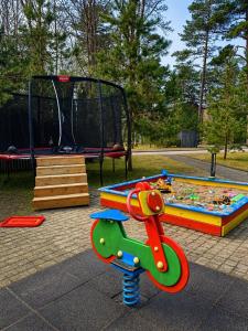 a play park with a playground with a play set at Klaipeda Seaside Apartments with self check-in in Klaipėda