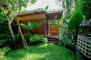 a small house in the middle of a garden at Ubud Jungle Stay - Mahari by WAHM in Ubud +83 photos