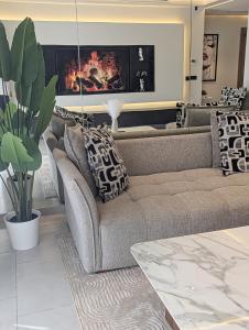 a living room with a couch and a fireplace at Elite'Stay by Al Amir in Cabo Negro +67 photos