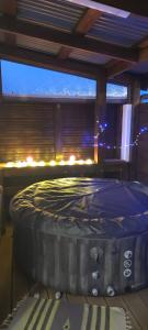 a bed in a room with a window at Fleur de Vanille in Saint-Philippe