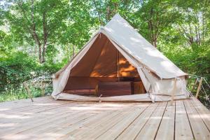 a canvas tent sitting on a wooden deck at Le Spot Passy in Passy