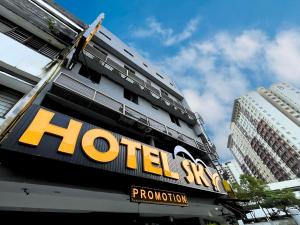 a hotel sign on the side of a building at Sky Hotel Cheras Maluri in Kuala Lumpur