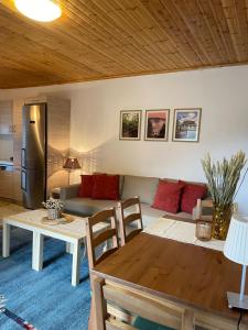 a living room with a couch and a table at Taygetos hut in Dhirrákhion +5 photos