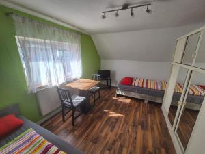 a room with two bunk beds and a table at Zimmervermietung Müller in Kelheim