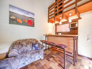 a living room with a couch and a table at Cosy holiday home in the Hochsauerland with terrace at the edge of the forest in Schmallenberg +154 photos