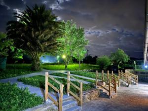 a wooden fence on a walkway at night at Eko apartamentos Astelarra in Muxika
