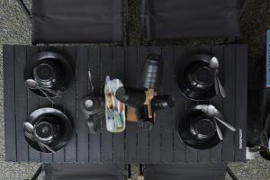 a black board with a bunch of different items on it at serlok glamping in Tangkubanperahu
