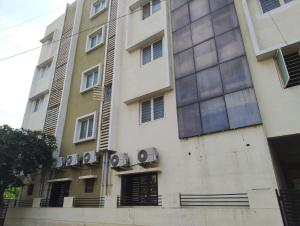 a building with a sign on the side of it at MVTJ Hotel in Bangalore +12 photos