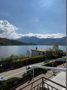 a view of a lake with mountains in the background at Albergo Mezzolago in Calceranica al Lago