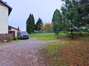 a van parked in the driveway of a house at Gîte chez la Marie in Épinal