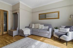 a living room with a couch and a chair at Riverside Crossing in Worcester