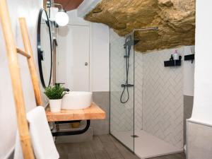 a bathroom with a shower and a sink at Casa isabel in Setenil +31 photos