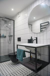 a bathroom with a sink and a mirror at Apartmán Pradědův in Šumperk +35 photos