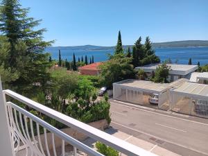 a view from a balcony of a town with the water at Hanna in Dramalj