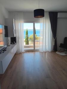 a living room with a view of the ocean at Hanna in Dramalj