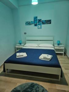 a bedroom with a bed with two trays on it at Bari Vecchia Dimora in Bari