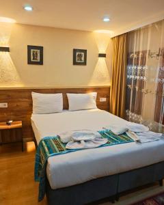 a hotel room with a bed in a room at Otantik Hotel in Istanbul +35 photos