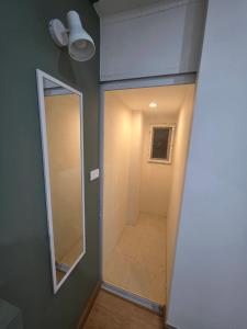 a bathroom with a mirror and a walk in shower at PKK hotel Residence in Bang Phli +37 photos