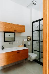 a bathroom with a sink and a toilet at La Paulowna Boutique Hotel in The Hague +54 photos