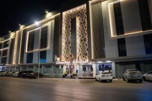 a large building with a sign that says hotel at Dana Hotel in Buraydah