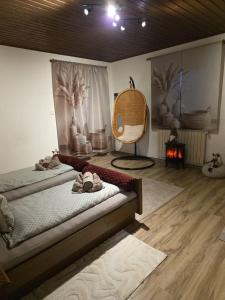 a room with two beds and a chair in it at Ferienwohnung Köck in Sankt Georgen bei Neumarkt +99 photos