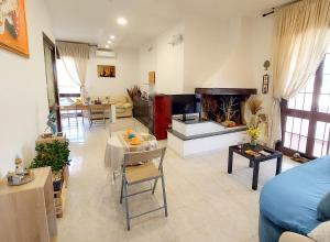 a living room with a couch and a fire place at Villa Mare Presepe in Torchiarolo